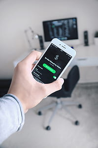 person holding iPhone displaying Do Not Disturb by Adam thumbnail