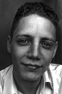 grayscale photo of man wearing collared top thumbnail