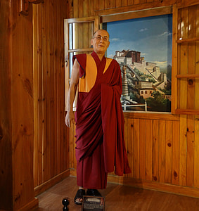 monk standing beside window thumbnail