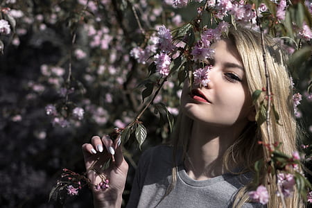 woman smelling floral flowers photo thumbnail