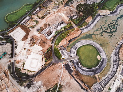 aerial photography of road beside body of water thumbnail