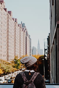 woman standing near buildings thumbnail