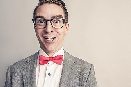 photo of man smiling in gray suit jacket thumbnail