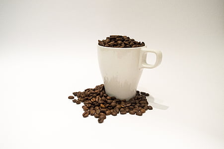 white mug filled with coffee beans thumbnail