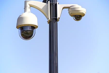 two white dome pole security cameras thumbnail