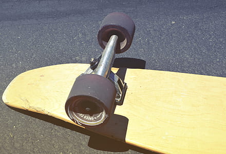 Brown Skateboard on Concrete Road thumbnail
