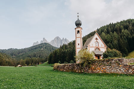 white and pink church near trees thumbnail