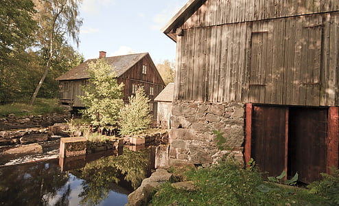two brown wooden houses thumbnail