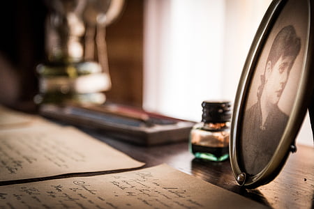 photo frame in front of letter on table thumbnail