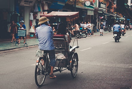 person riding on bicycle with wheelchair thumbnail