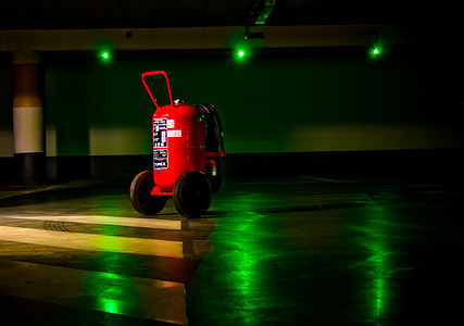 red air compressor in parking lot thumbnail
