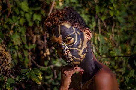 Close-Up Photography of Person With Face Paint thumbnail