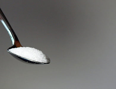 gray stainless steel spoon with white powder close-up photo thumbnail