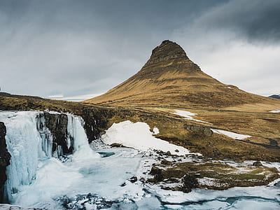 waterfalls next to mountain thumbnail