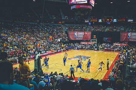 men playing basketball wearing blue and white jerseys thumbnail