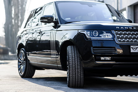 black Land Rover Range Rover Sport HSE SUV parked near concrete building thumbnail