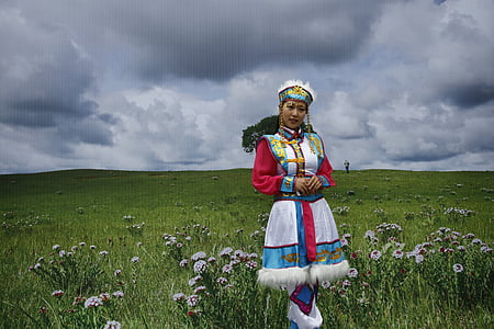 woman standing on grass field thumbnail