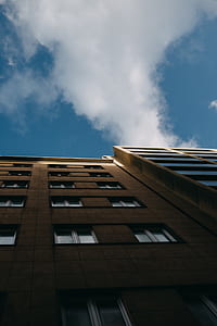 worms eye view of brown concrete building thumbnail