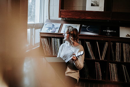 woman playing guitar in bokeh photography thumbnail