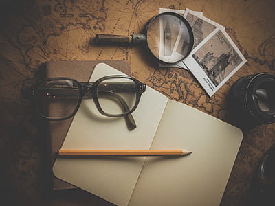 brown pencil and black framed eyeglasses thumbnail