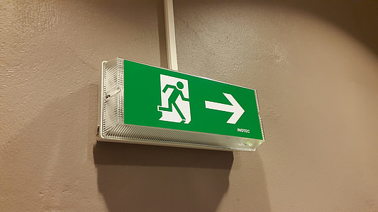 green and white signage on wall thumbnail