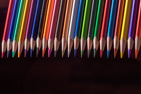 person showing assorted color pencils thumbnail