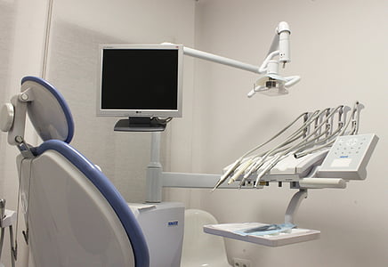 white dentist chair in white wall painted room thumbnail