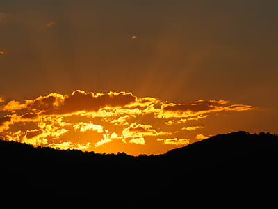 silhouette of mountain during golden hour thumbnail