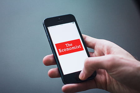 person holding turned-on space gray iPhone 5s thumbnail