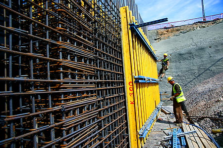man standing in front of metal wall thumbnail