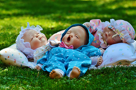 four baby doll toys on grass thumbnail