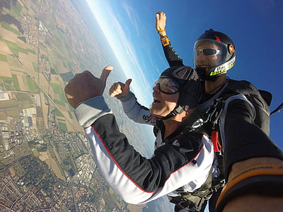 two person talking photo while skydiving during daytime thumbnail