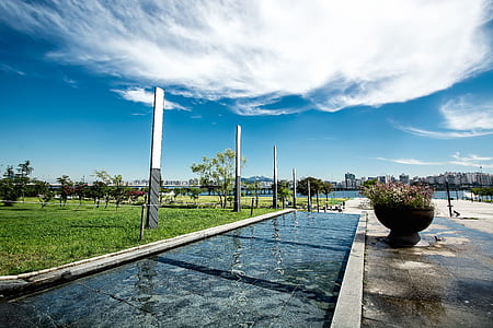 body of water under white clouds thumbnail