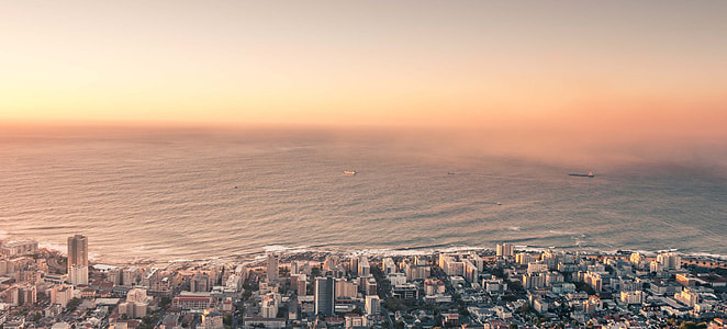aerial view of high rise building near the body of water thumbnail