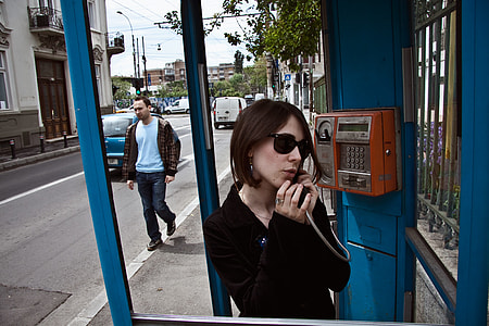 Girl in phone booth thumbnail