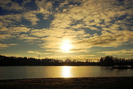 body of water under blue sky thumbnail