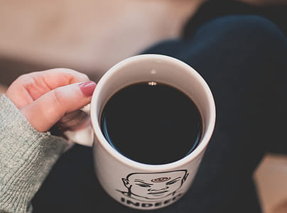 Black Beverage in White and Black Ceramic Mug thumbnail