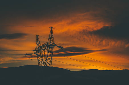 gray electrical tower during sunset thumbnail