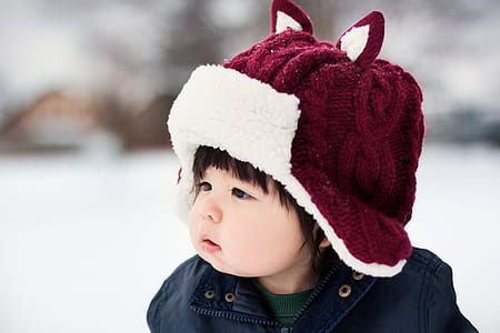 girl in blue shirt wearing maroon hat thumbnail