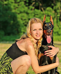 woman hugging Doberman pinscher thumbnail