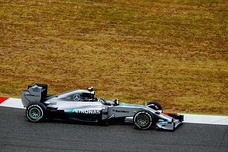 gray and black Mercedes-Benz Formula One car on track thumbnail