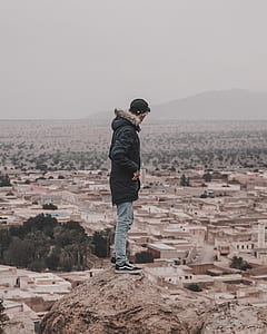 man standing on cliff thumbnail