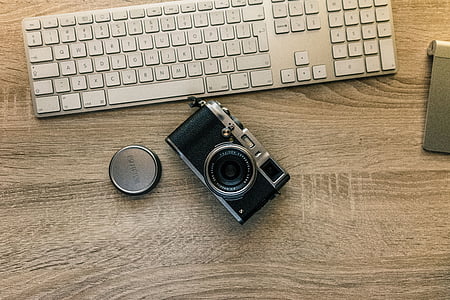 black and gray point-and-shoot camera thumbnail