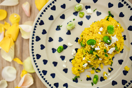 Risotto with broad bean on a cute plate with blue hearts thumbnail