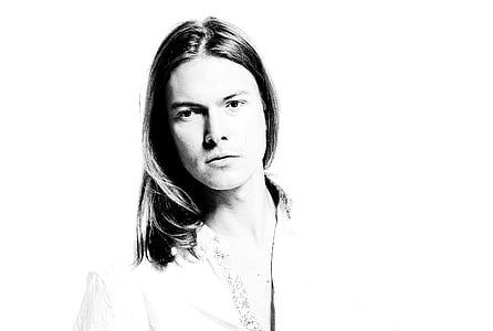 grayscale photo of man wearing collared top thumbnail