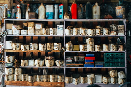 white cups on gray metal rack thumbnail