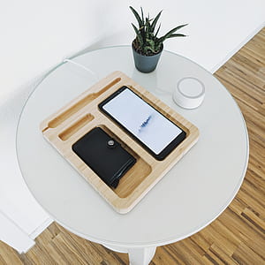black Android smartphone on top of brown wooden tray thumbnail