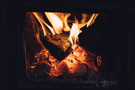 close-up photo of brown firewood with fire thumbnail