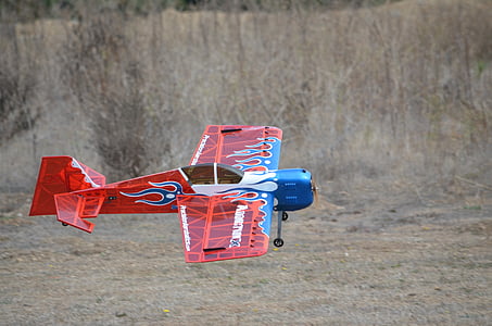 red and blue propeller plane toy thumbnail