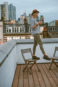 woman on top of chairs thumbnail